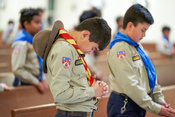 Explorer praying on retreat