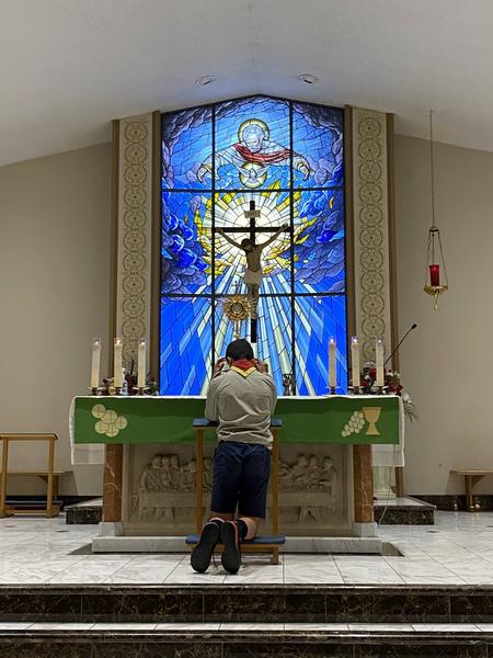 Explorer praying on retreat